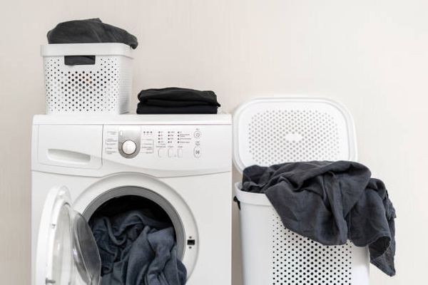 A washer and laundry basket